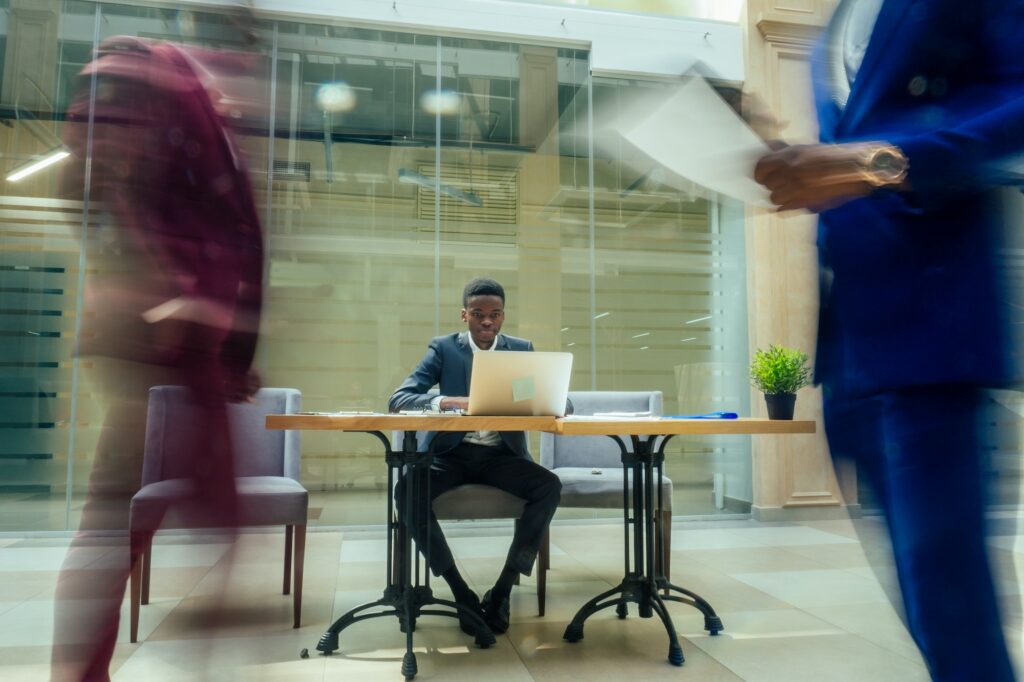africa american business man working with laptop,blurred people